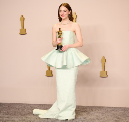 Emma Stone wore a pale seafoam green Louis Vuitton for her 'surprise' Oscar win