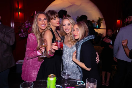 Taylor Swift & Brittany Mahomes posed together at an Eras-themed party