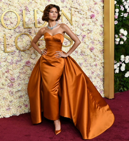 Zendaya wore a custom, burnt-orange Louis Vuitton gown to the Globes