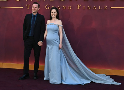 Michelle Dockery revealed her Prada-clad baby bump at the 'Downton' premiere